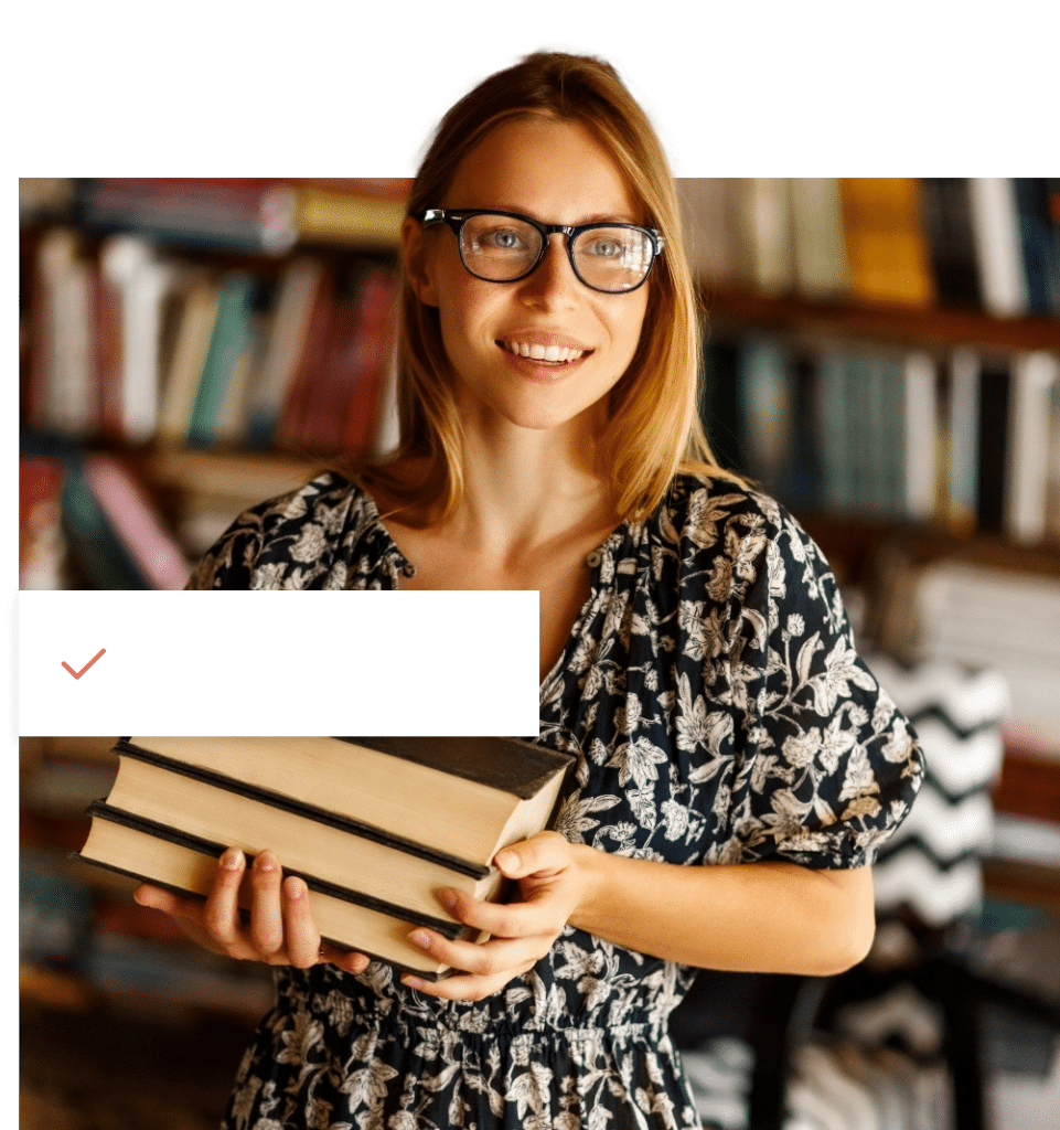 Woman in Book Store with a Stack of Books