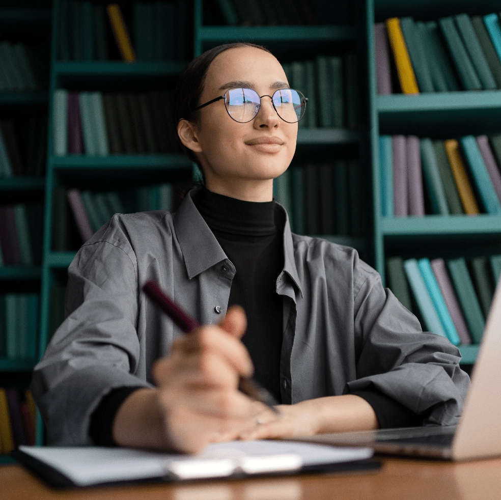 financier-in-glasses-woman-uses-a-laptop