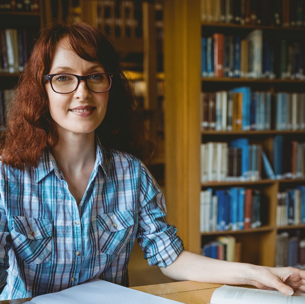 mature-student-studying-in-library-at-the-university